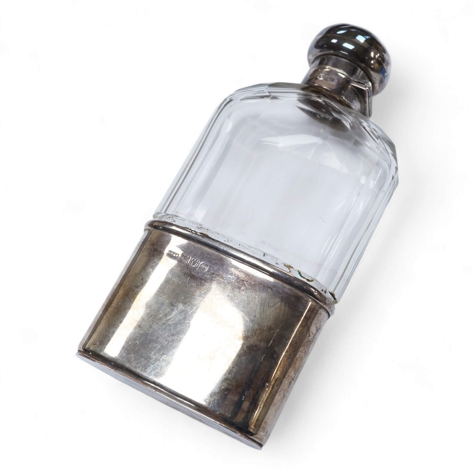 A George V silver mounted glass hip flask, with cup base, by Mappin & Webb, London, 1912, 15.8cm.